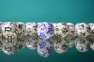 White bingo balls with black and blue nuumbers