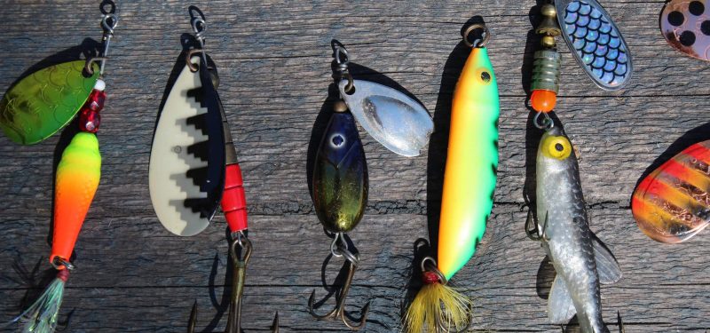 Several multi-colored fishing lures.