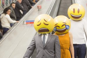 People with emoji masks