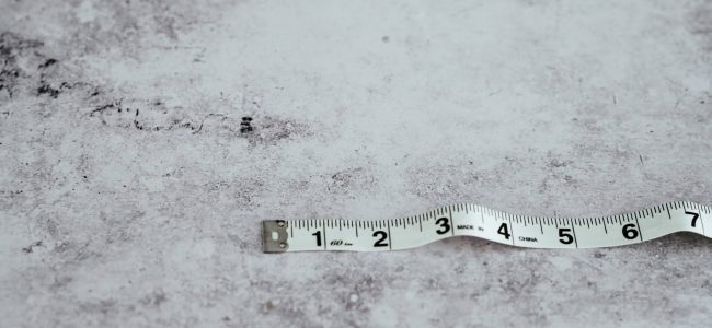 White tape measure on white background 