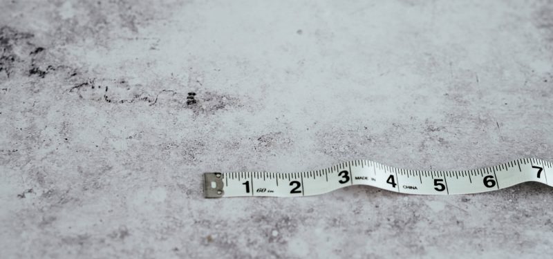 White tape measure on white background 