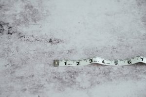 White tape measure on white background 